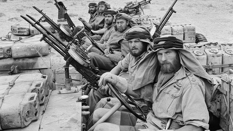 The Special Air Service (SAS) in North Africa during the Second World War: a close-up of a heavily armed patrol of 'L' Detachment SAS in their Jeeps, just back from a three-month assignment. The crews of the jeeps are all wearing 'Arab-style' headdress, a