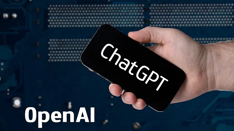 Hand holding smartphone with ChatGPT and OpenAI text (52917312010)