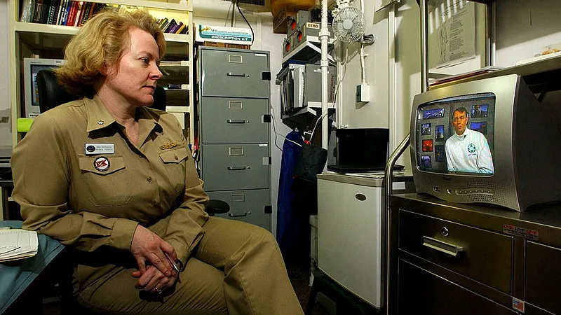 US Navy 030316-N-4308O-015 Cdr. Erin Patterson, Medical Officer aboard USS Harry S. Truman (CVN 75), watches a 'safety stand-down video' in her office