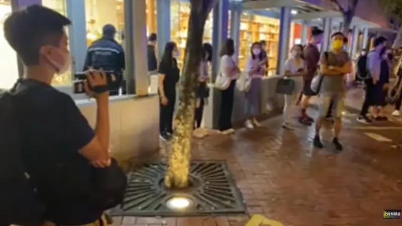 Police video recording people waiting bus 20220615-1